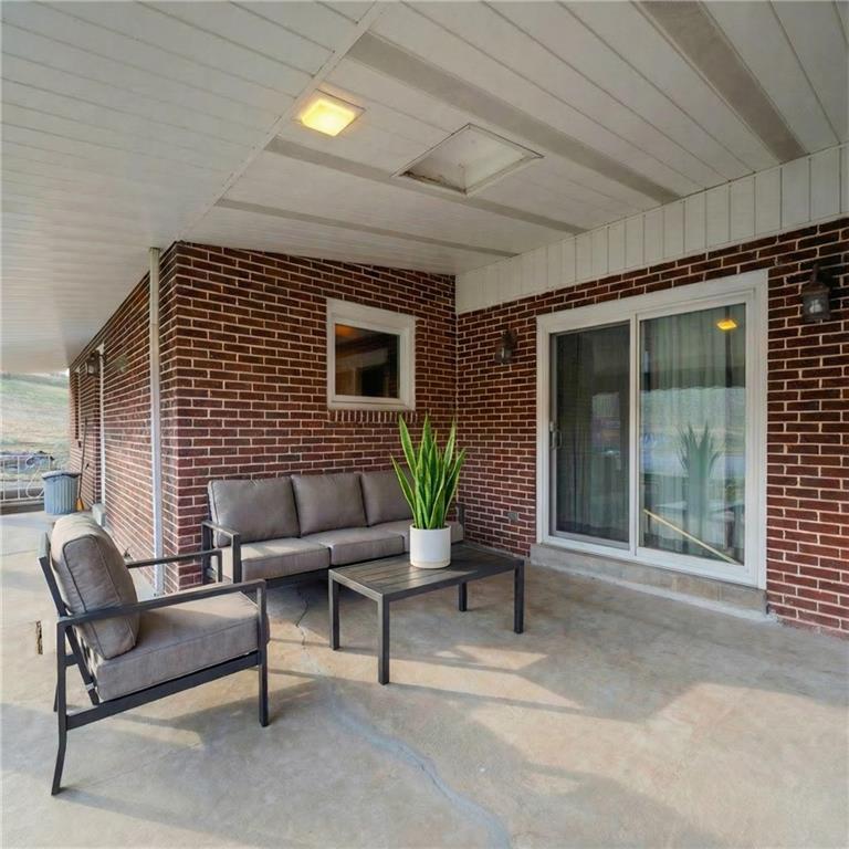 905 Watt Road Apollo, PA 15613 - Photo 23 of 30 a balcony with furniture and a potted plant