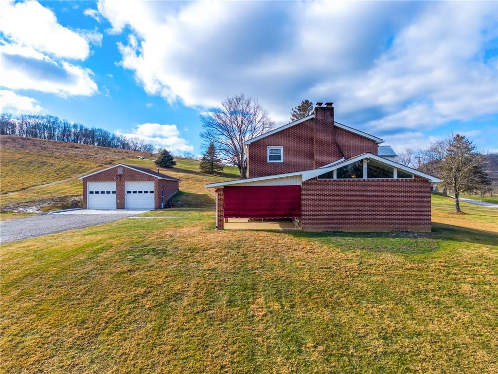 905 Watt Road Apollo, PA 15613 - Photo 28 of 30 a swimming pool with outdoor seating and yard