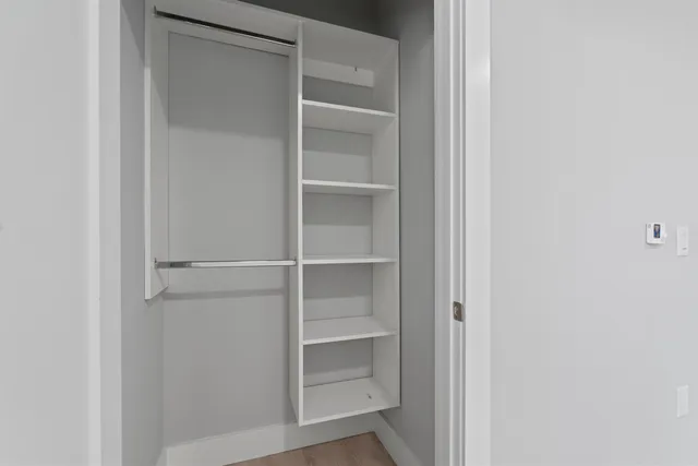 a view of an empty walk in closet