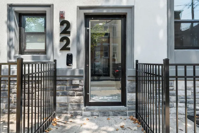 a view of a porch with a door and a window