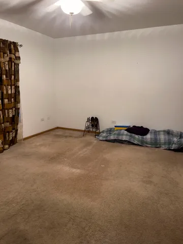 a view of an empty room and wooden floor