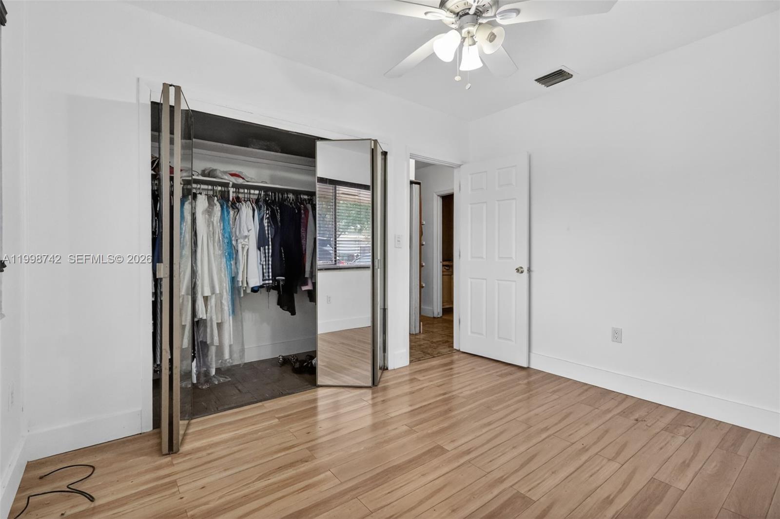 733 West 33rd Street Hialeah, FL 33012 - Photo 11 of 45 a view of a room with wooden floor