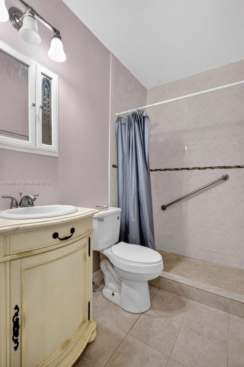 733 West 33rd Street Hialeah, FL 33012 - Photo 15 of 45 a bathroom with a sink a toilet and shower