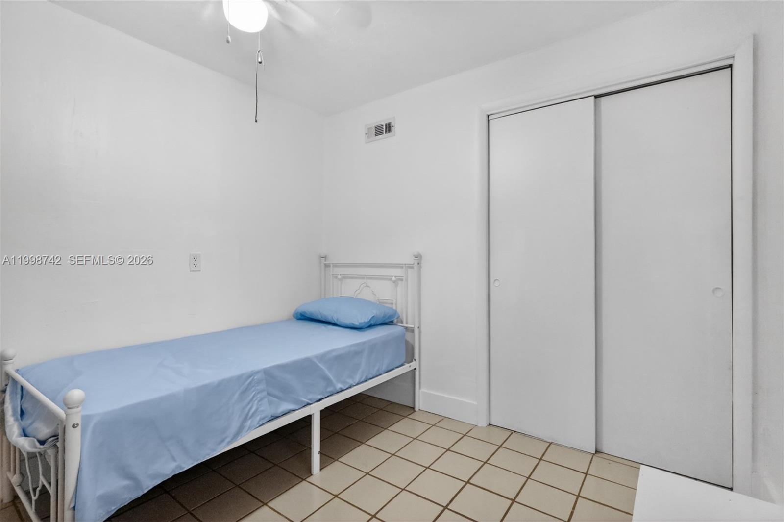 733 West 33rd Street Hialeah, FL 33012 - Photo 17 of 45 a bedroom with a bed and a shower