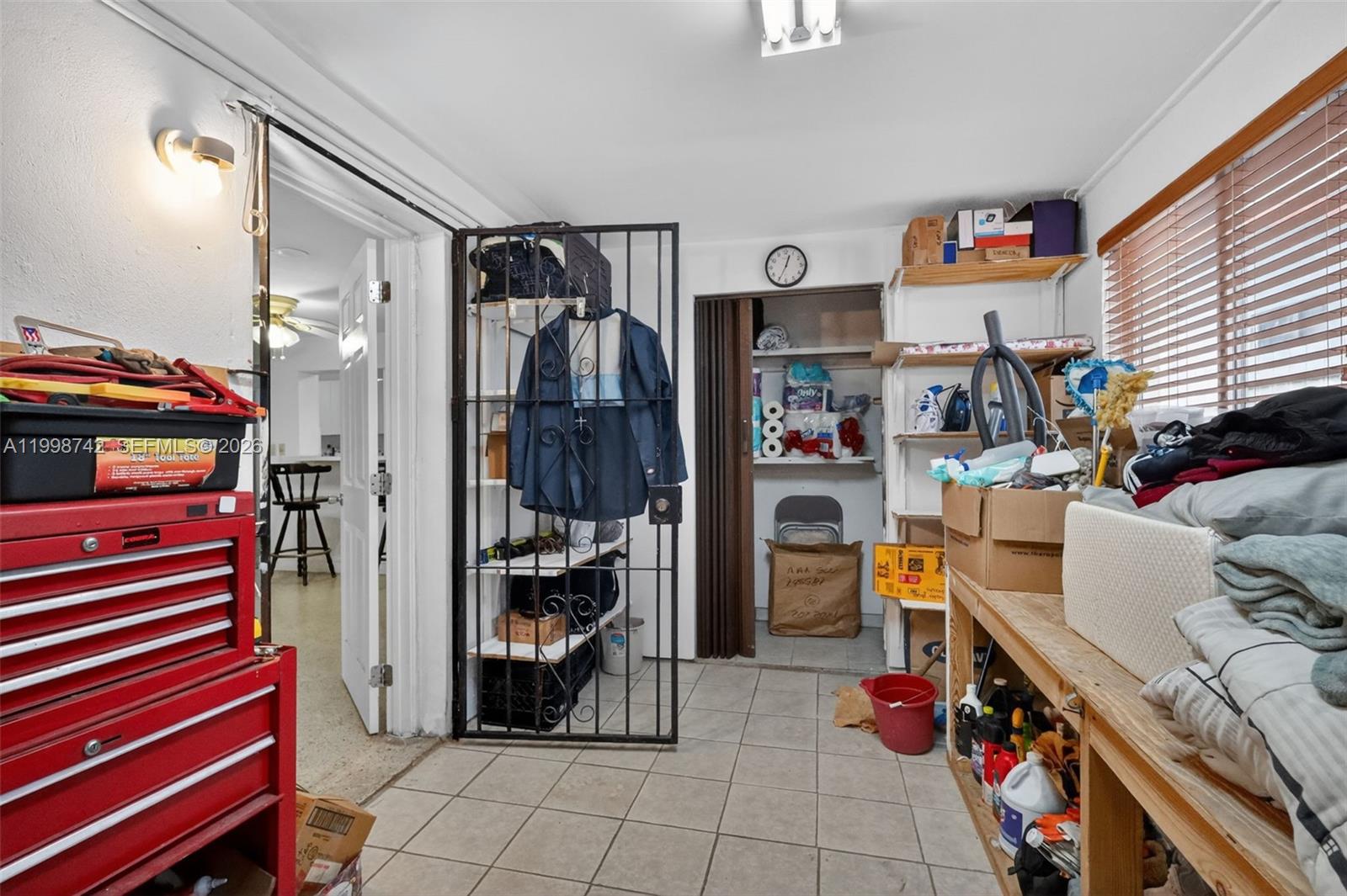 733 West 33rd Street Hialeah, FL 33012 - Photo 31 of 45 a view of walk in closet with clothes and shoes