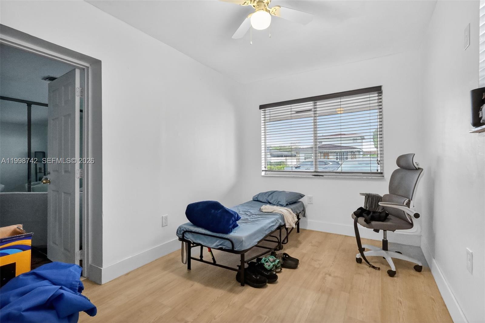 733 West 33rd Street Hialeah, FL 33012 - Photo 32 of 45 a living room with furniture and a window