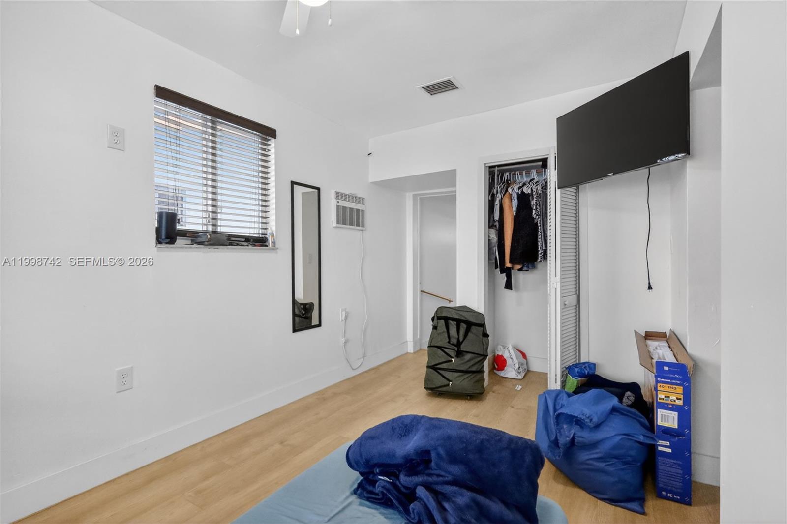 733 West 33rd Street Hialeah, FL 33012 - Photo 33 of 45 a living room with furniture and a flat screen tv