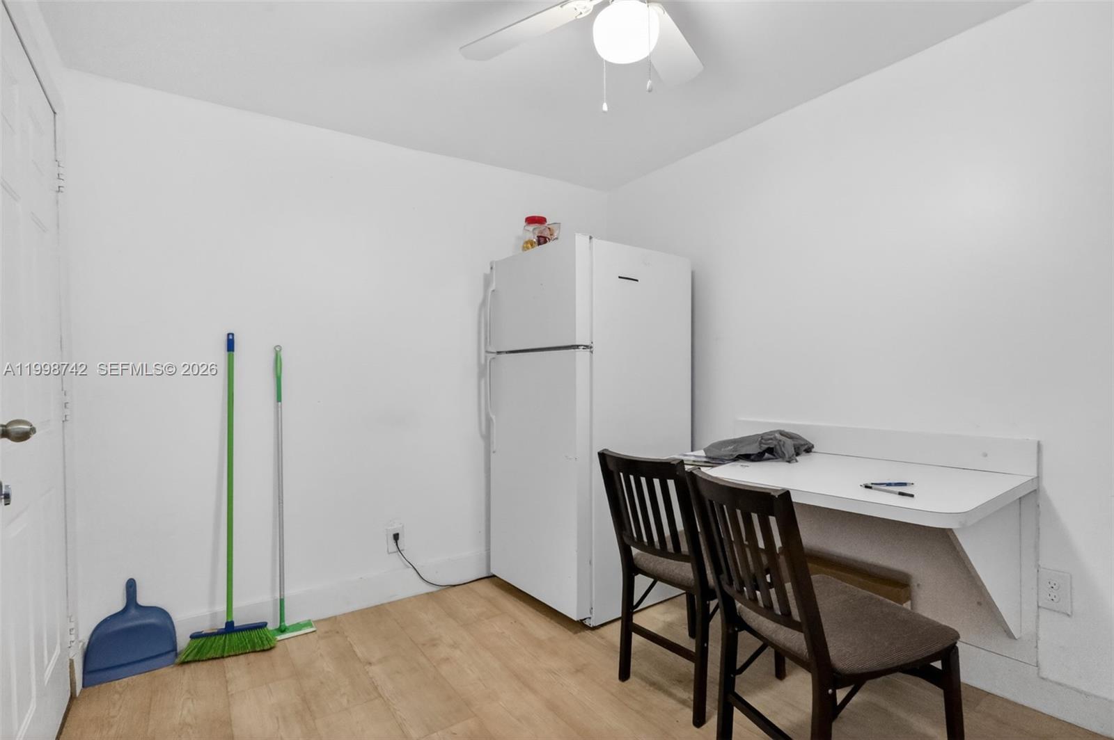 733 West 33rd Street Hialeah, FL 33012 - Photo 38 of 45 a view of a kitchen with furniture and wooden floor