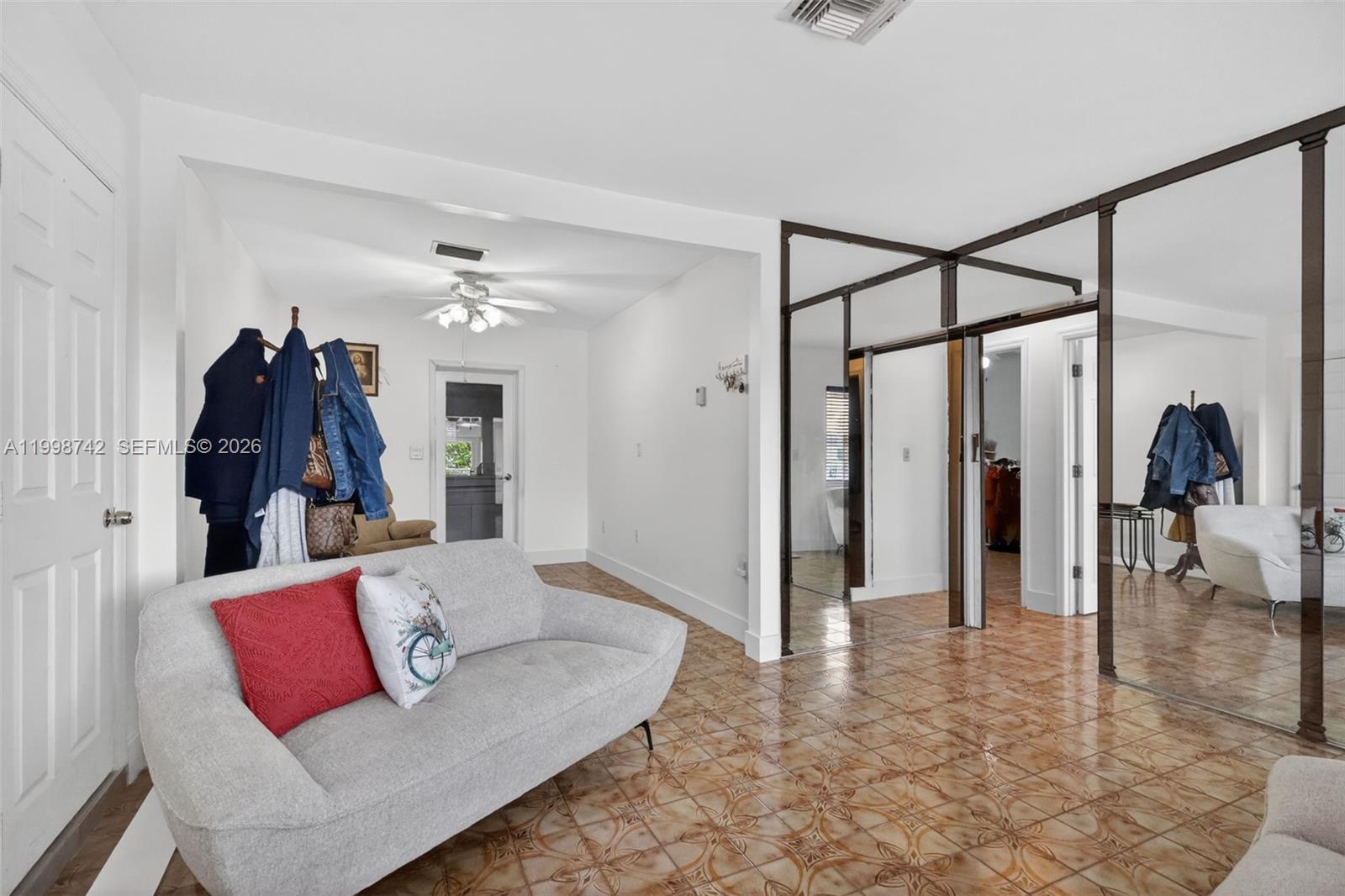 733 West 33rd Street Hialeah, FL 33012 - Photo 4 of 45 a living room with furniture and a rug