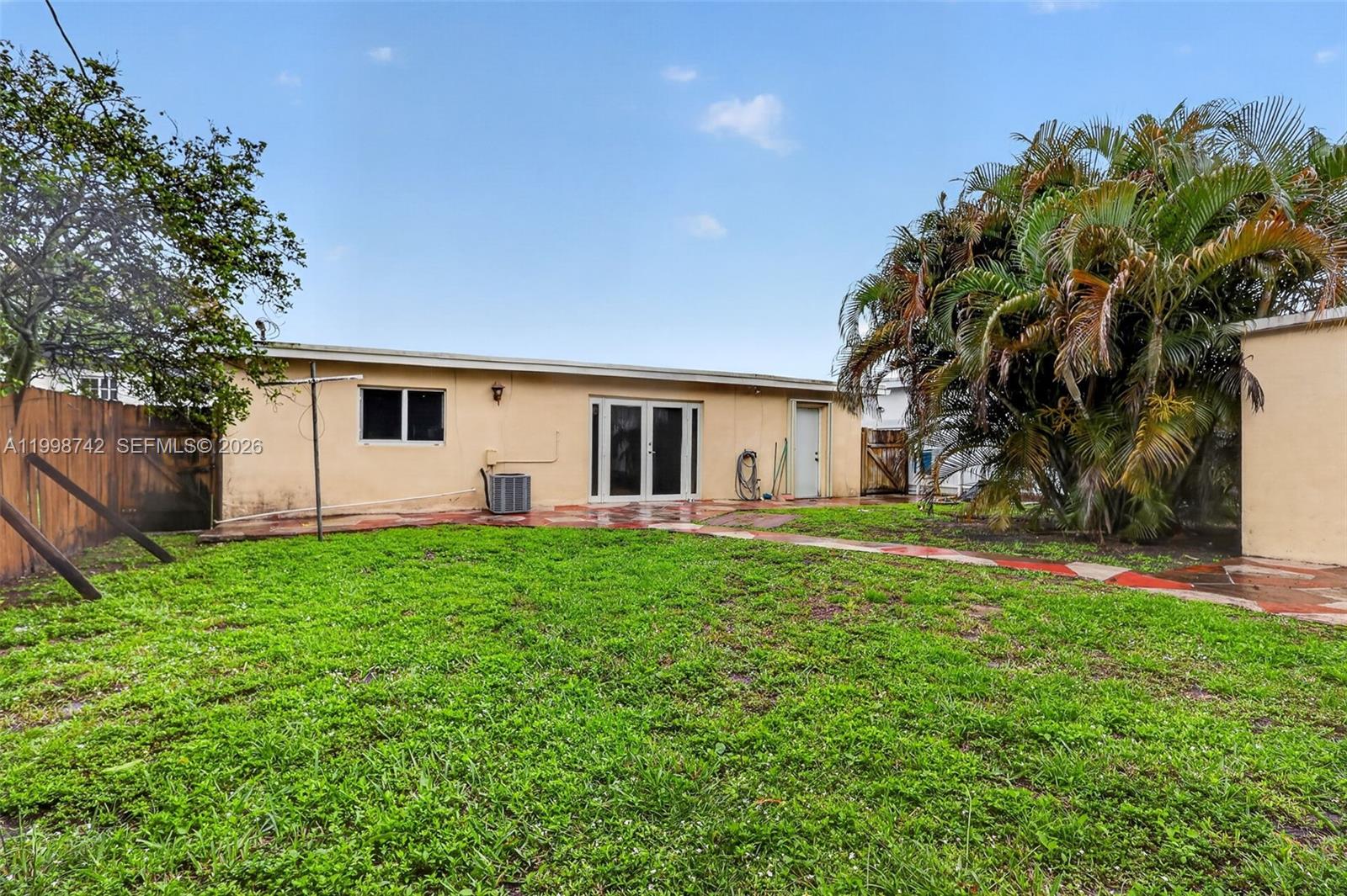733 West 33rd Street Hialeah, FL 33012 - Photo 42 of 45 a front view of house with yard and green space