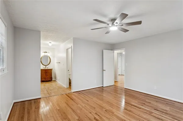 a view of an empty room and wooden floor