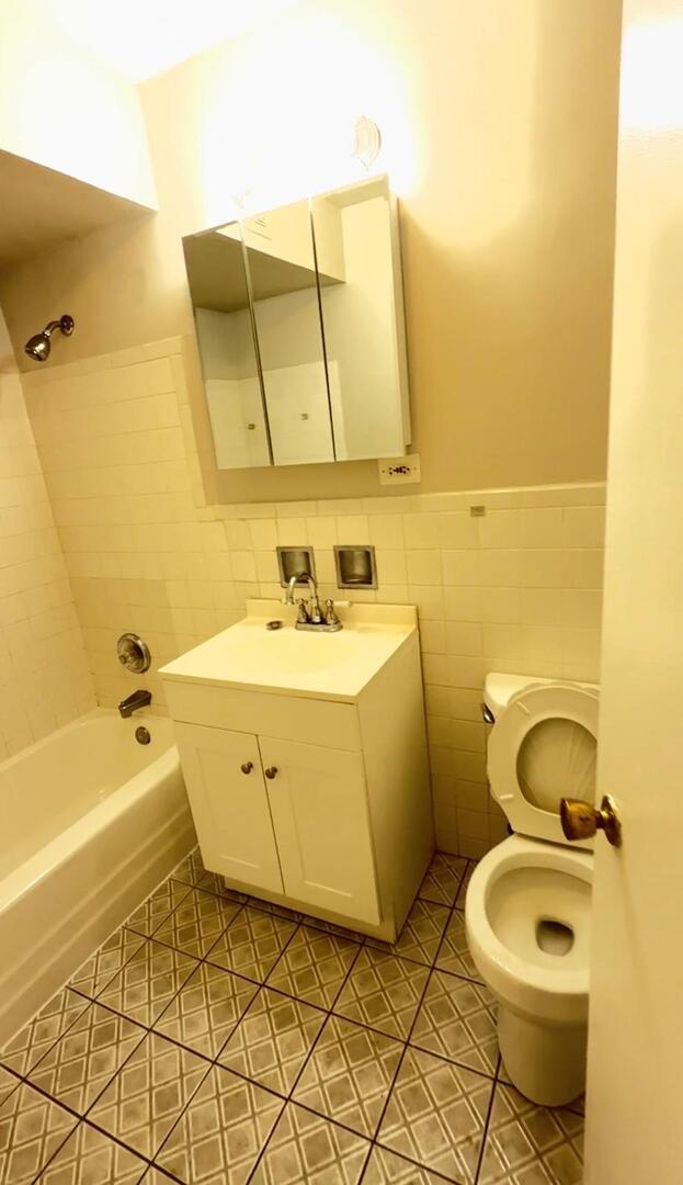 1119 East Algonquin Road, Unit 2 Arlington Heights, IL 60005 - Photo 11 of 30 a bathroom with a sink and a mirror