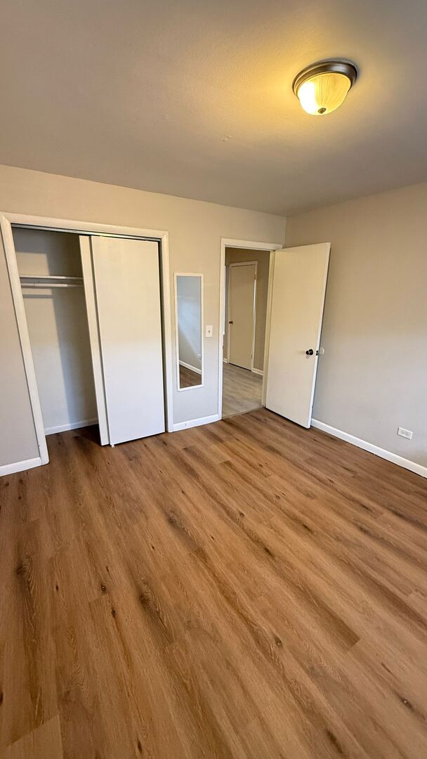 1119 East Algonquin Road, Unit 2 Arlington Heights, IL 60005 - Photo 19 of 30 a view of empty room with wooden floor