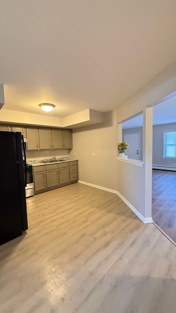 1119 East Algonquin Road, Unit 2 Arlington Heights, IL 60005 - Photo 29 of 30 a view of empty room with wooden floor