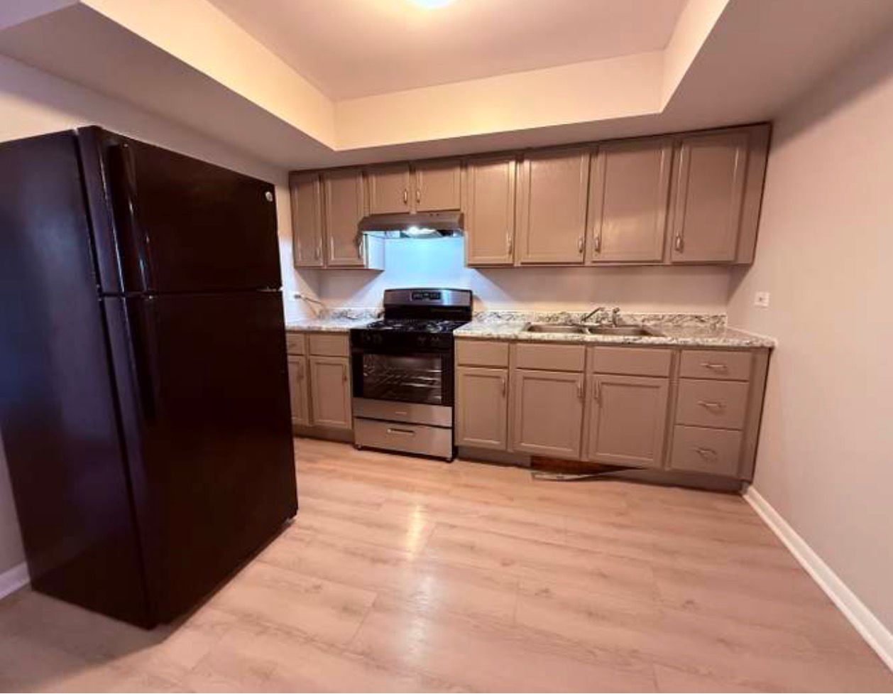 1119 East Algonquin Road, Unit 2 Arlington Heights, IL 60005 - Photo 9 of 30 a kitchen with stainless steel appliances granite countertop a refrigerator and a sink