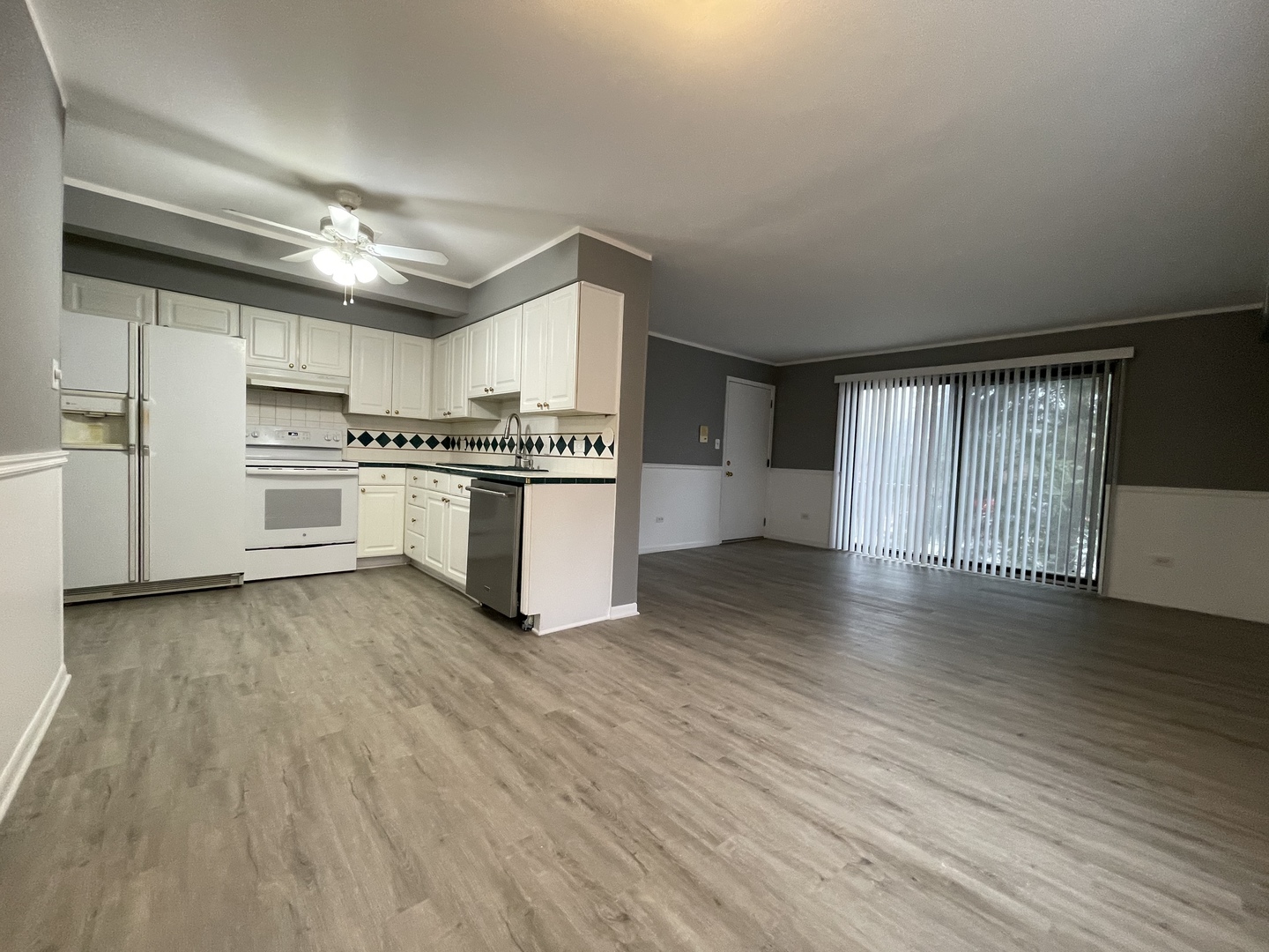 7533 SW Highway, Unit 2E Worth, IL 60482 - Photo 2 of 10 a kitchen with stainless steel appliances granite countertop a stove and a refrigerator