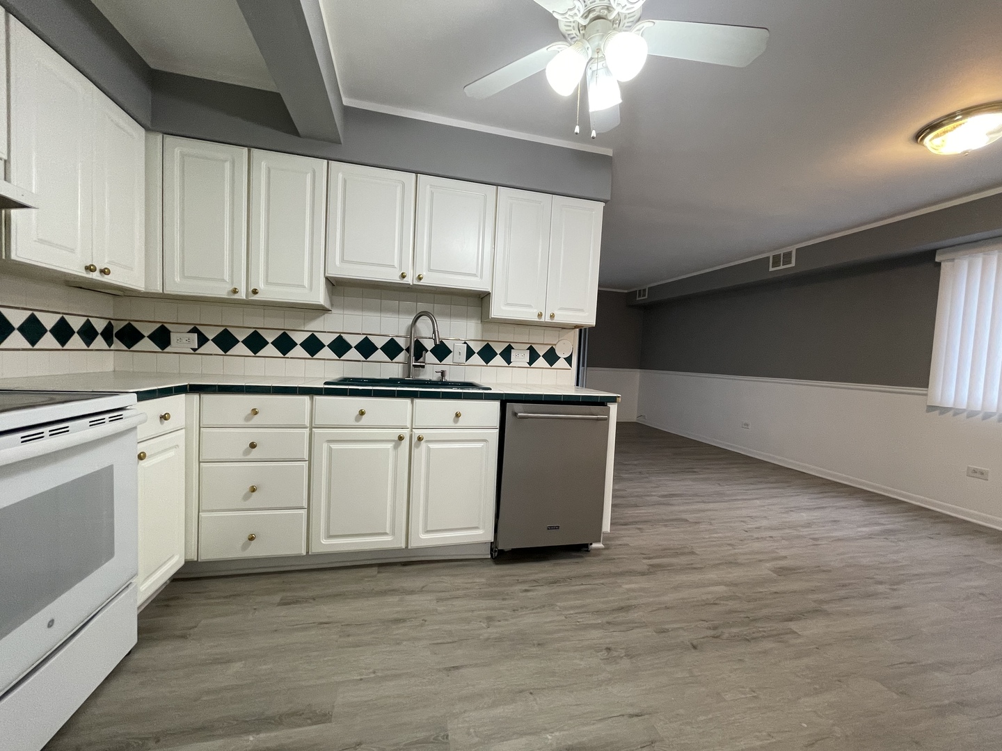 7533 SW Highway, Unit 2E Worth, IL 60482 - Photo 3 of 10 a kitchen with white cabinets