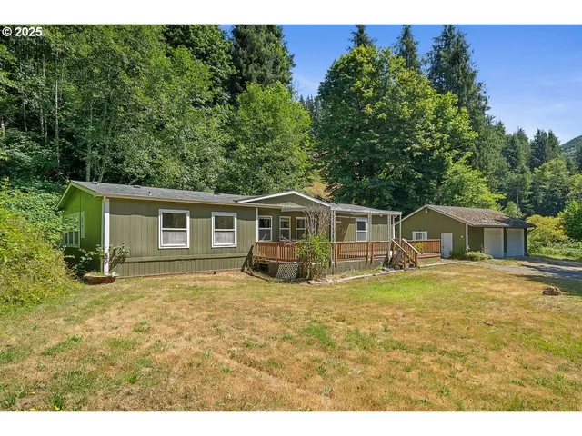 a house that has a tree in front of it