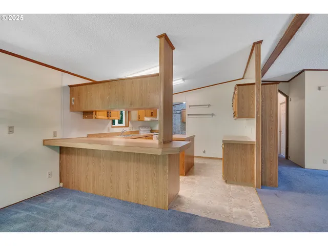 a kitchen with stainless steel appliances wooden cabinets and a granite counter tops