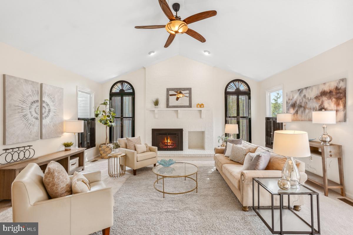 10 Leatherleaf Court Gaithersburg, MD 20878 - Photo 18 of 47 a living room with furniture a fireplace and a chandelier