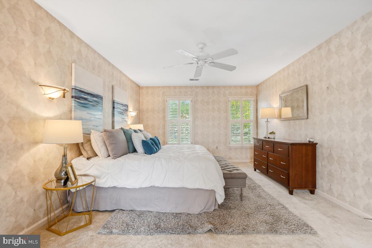 10 Leatherleaf Court Gaithersburg, MD 20878 - Photo 25 of 47 a bedroom with a bed and wooden floor