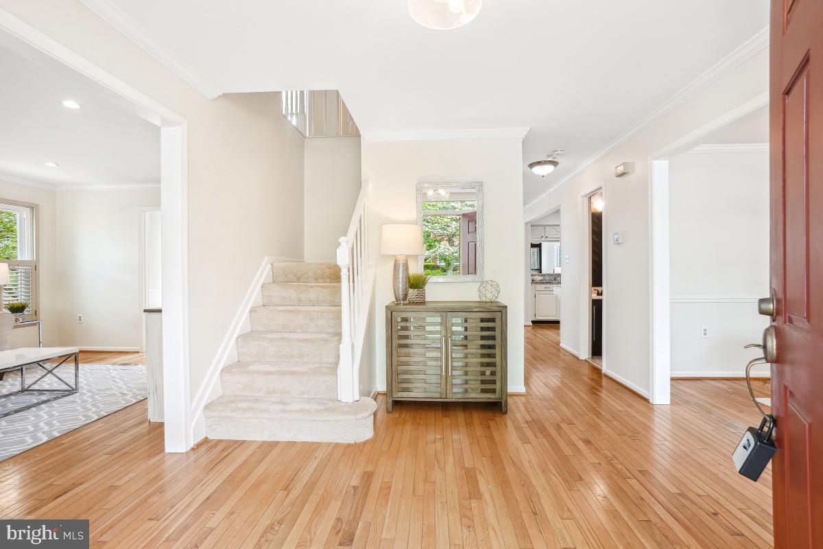 10 Leatherleaf Court Gaithersburg, MD 20878 - Photo 4 of 47 wooden floor in an empty room with a fireplace