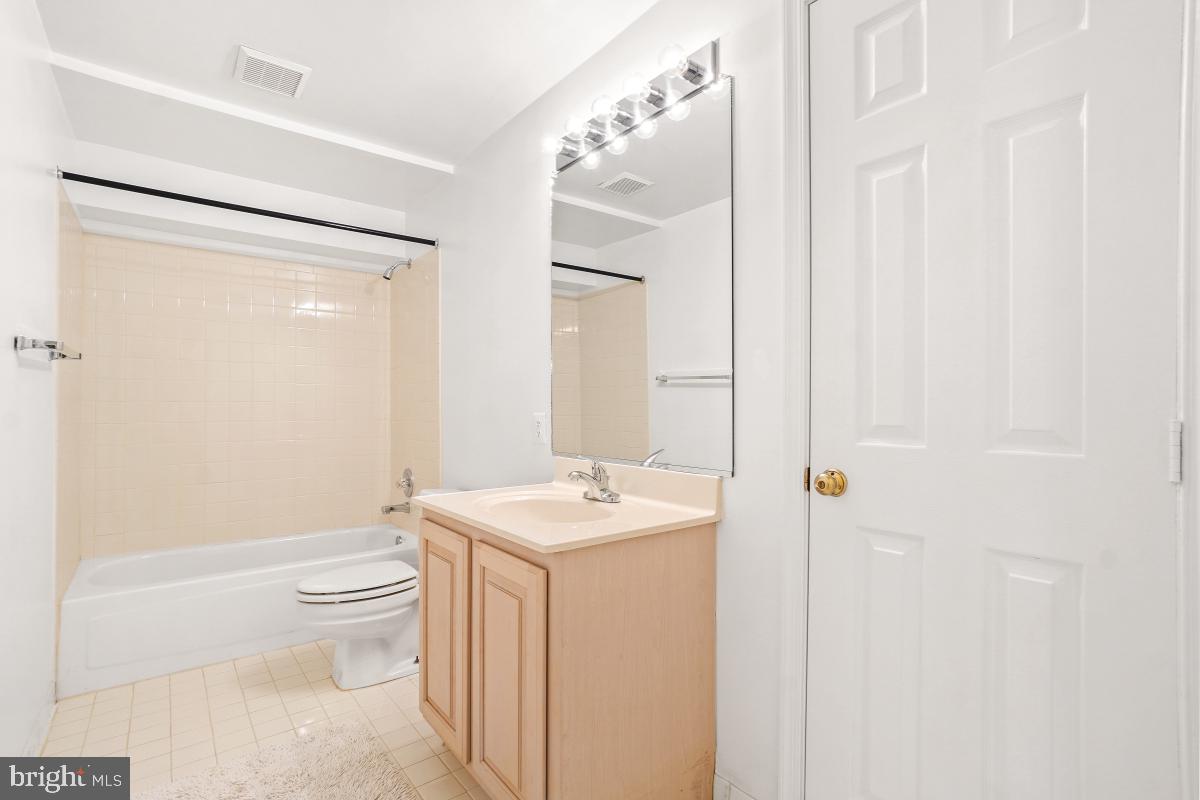 10 Leatherleaf Court Gaithersburg, MD 20878 - Photo 42 of 47 a bathroom with a sink a toilet and shower