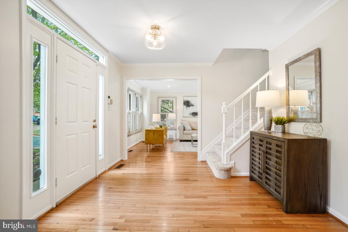10 Leatherleaf Court Gaithersburg, MD 20878 - Photo 5 of 47 a view of an entryway with wooden floor and a livingroom view