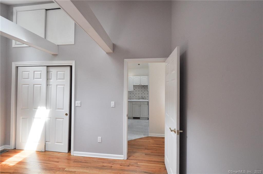 1500 Redding Road Fairfield, CT 06824 - Photo 20 of 22 The bedroom offers a spacious closet with additional storage above.
