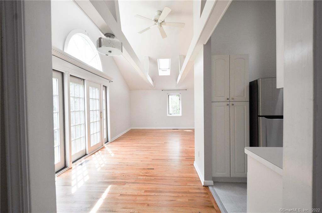 1500 Redding Road Fairfield, CT 06824 - Photo 5 of 22 Welcome to this spacious and bright open concept living area with 9+ foot ceilings, loads of windows and skylights.