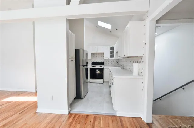a view of kitchen and wooden floor