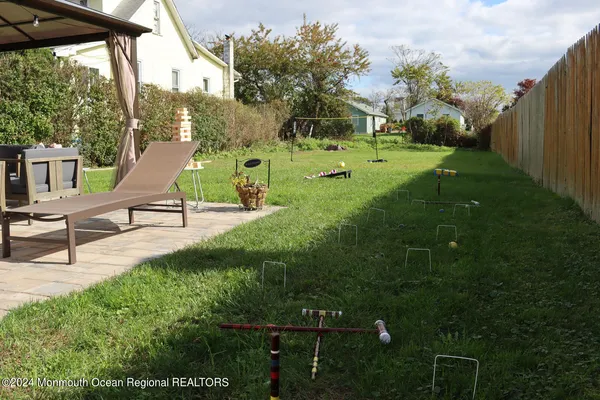 a view of a garden with lawn chairs