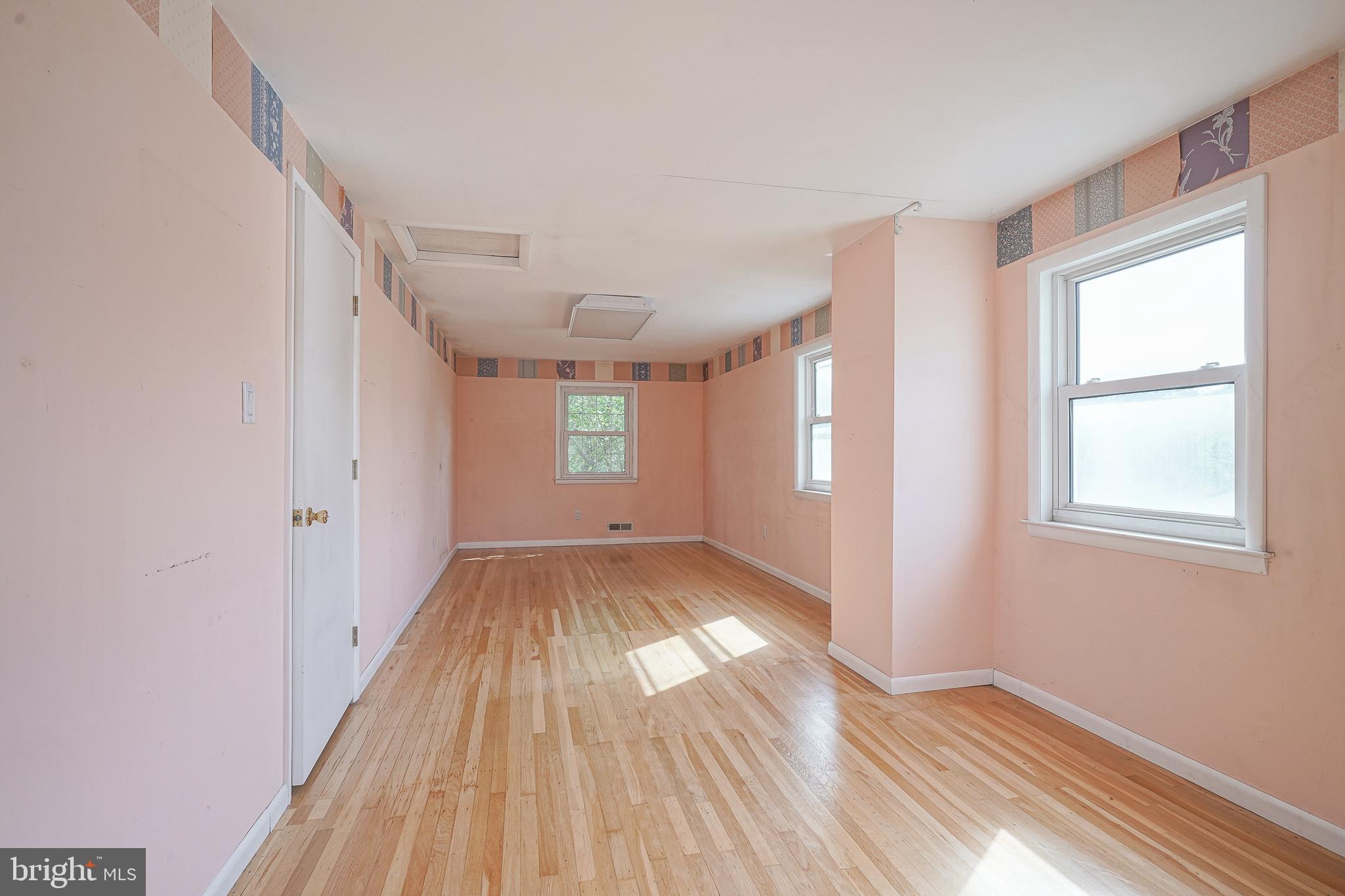 152 Kelly Driver Road Laurel Springs, NJ 08021 - Photo 21 of 30 a view of an empty room with wooden floor and a window