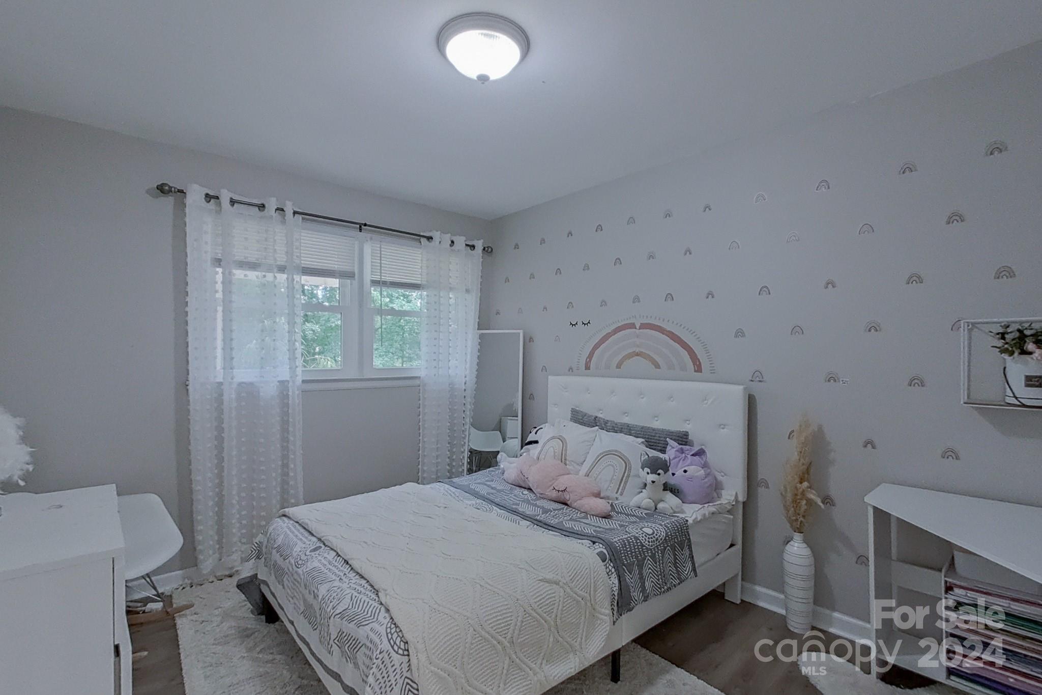 202 Smith Street Locust, NC 28097 - Photo 18 of 42 a bedroom with a bed and a window