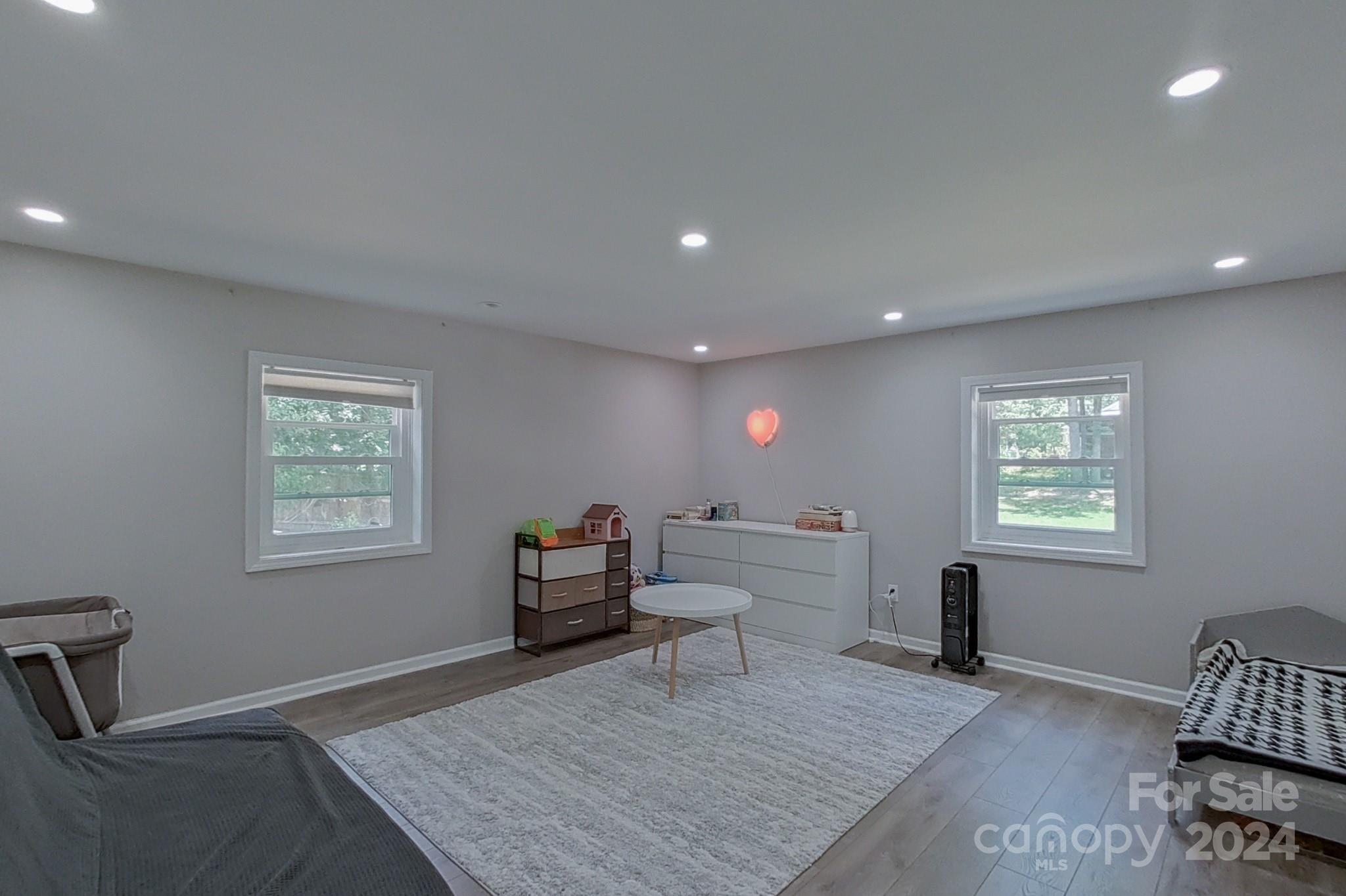 202 Smith Street Locust, NC 28097 - Photo 21 of 42 a living room with furniture and a window