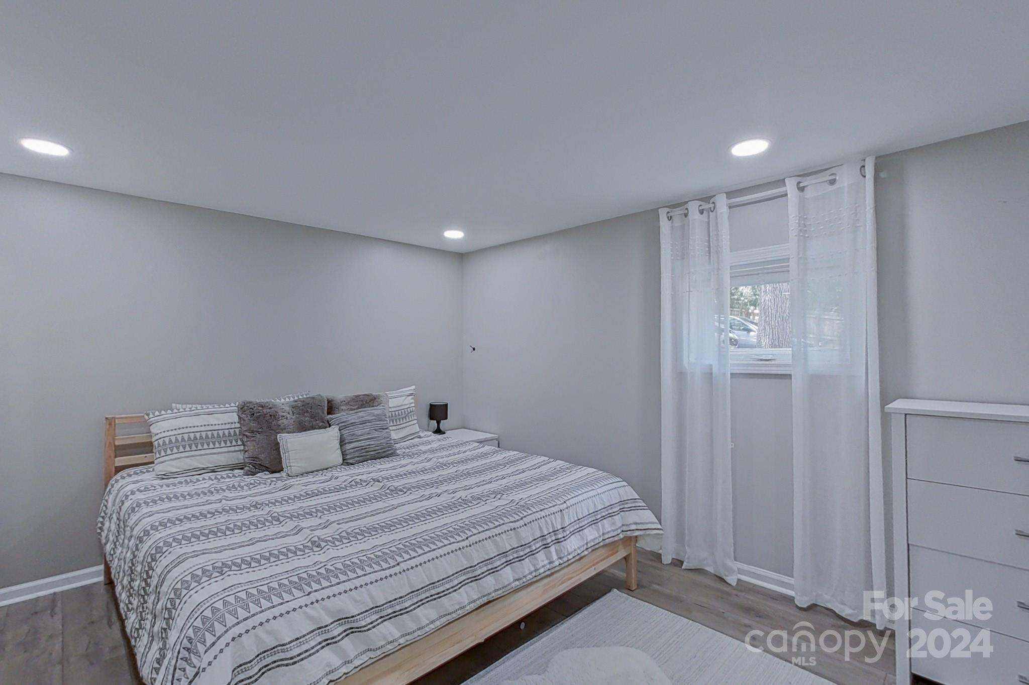 202 Smith Street Locust, NC 28097 - Photo 24 of 42 a bedroom with a bed and a closet