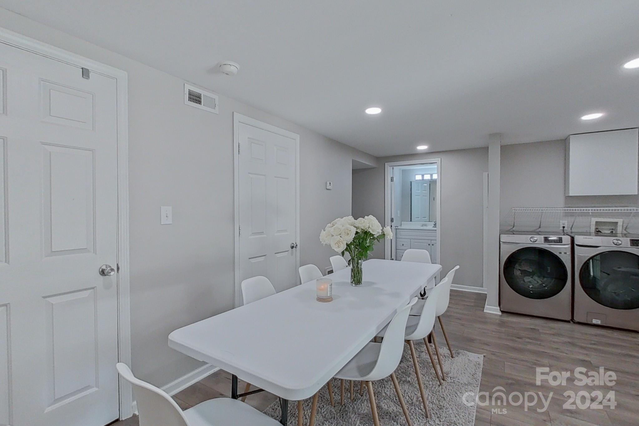 202 Smith Street Locust, NC 28097 - Photo 28 of 42 a view of a dining room with furniture and wooden floor