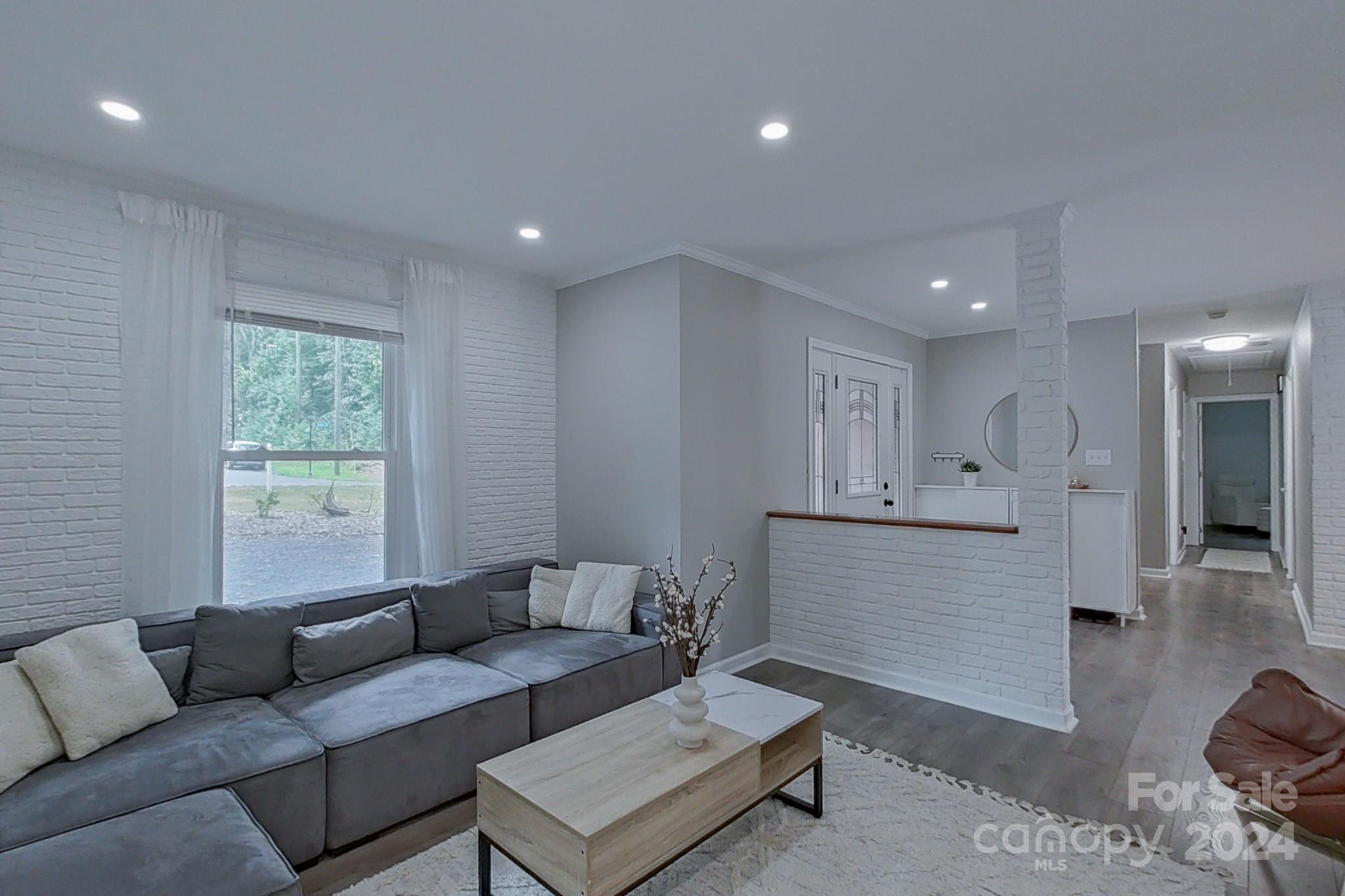 202 Smith Street Locust, NC 28097 - Photo 6 of 42 a living room with furniture and a window