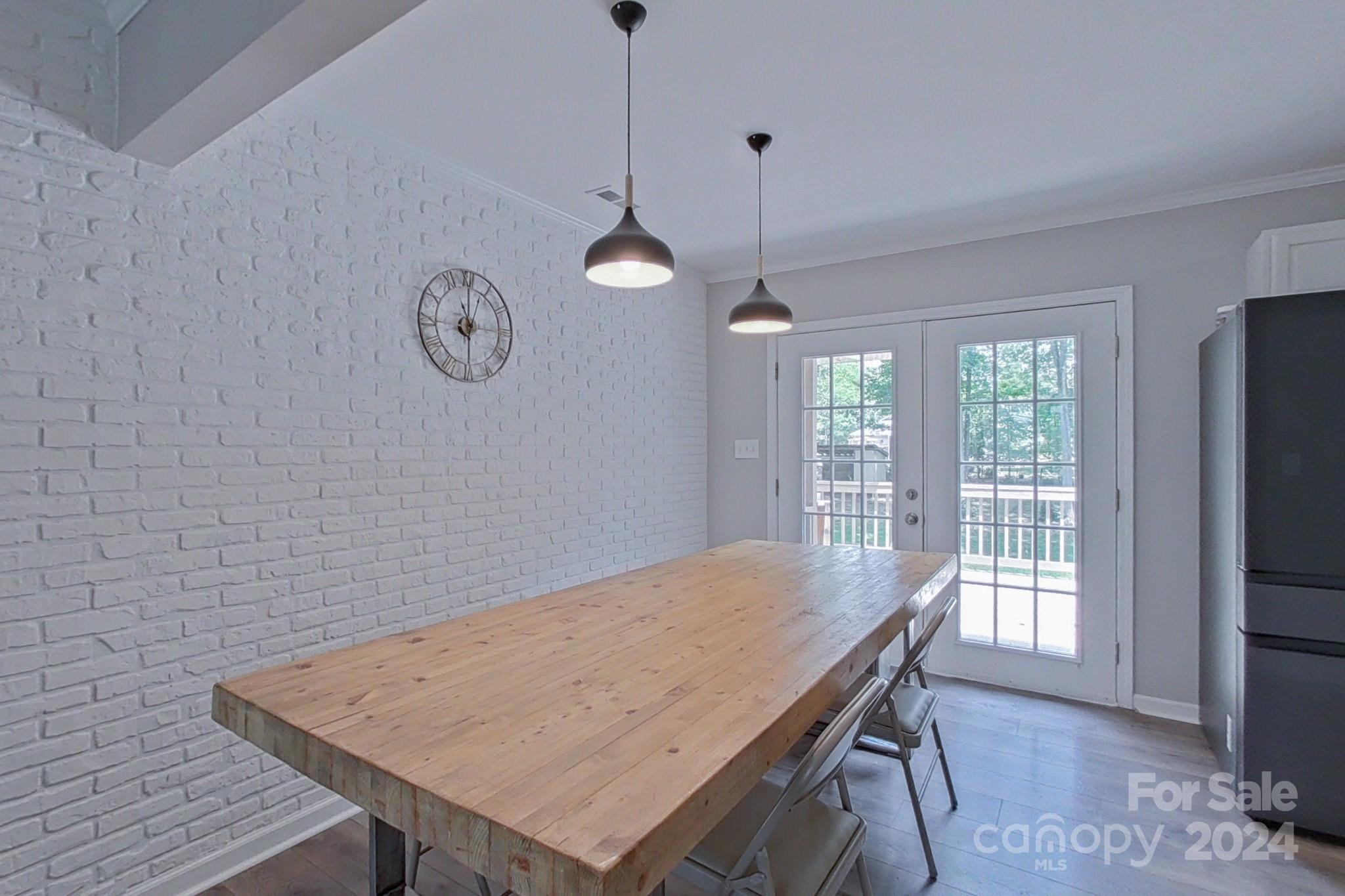 202 Smith Street Locust, NC 28097 - Photo 9 of 42 a view of a dining room with furniture window and wooden floor