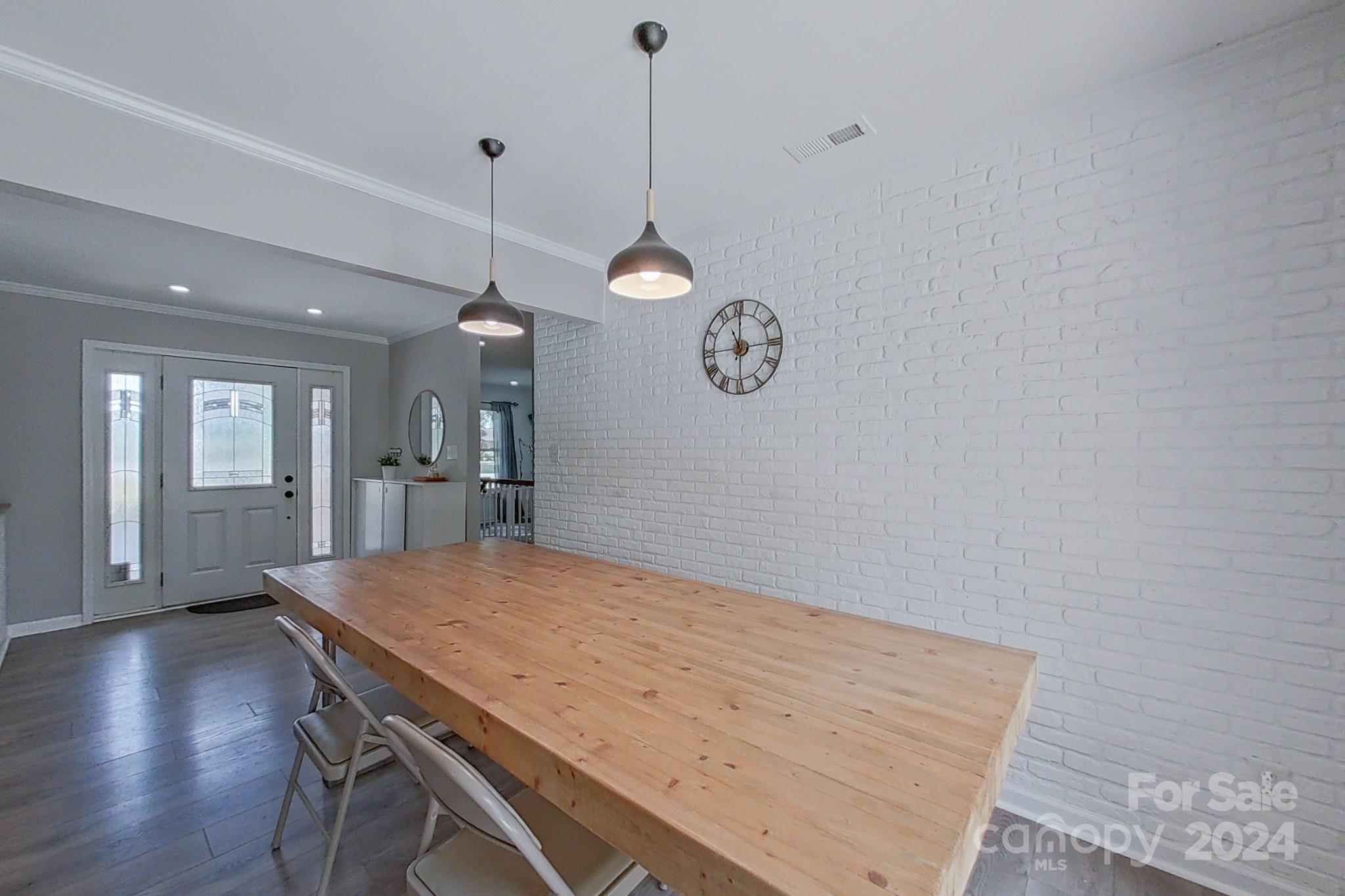 202 Smith Street Locust, NC 28097 - Photo 10 of 42 a view of a kitchen with a table and chairs