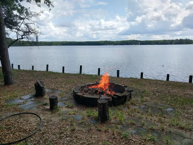 a view of a lake with outdoor seating