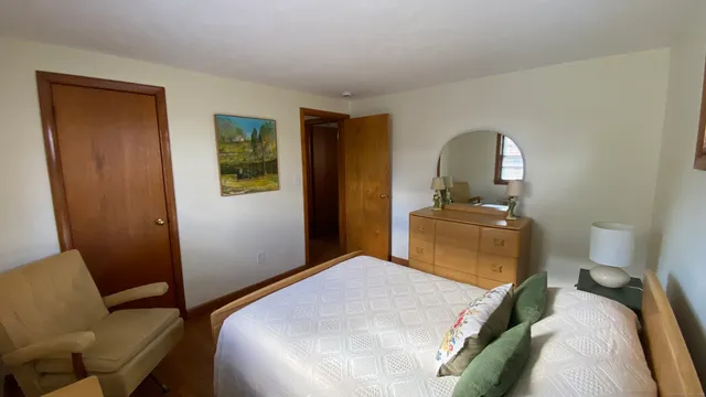 a bedroom with a bed and a bathroom