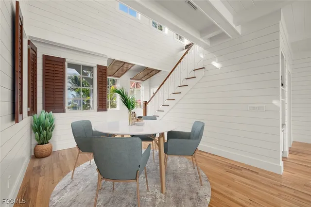 a view of an entryway with wooden floor