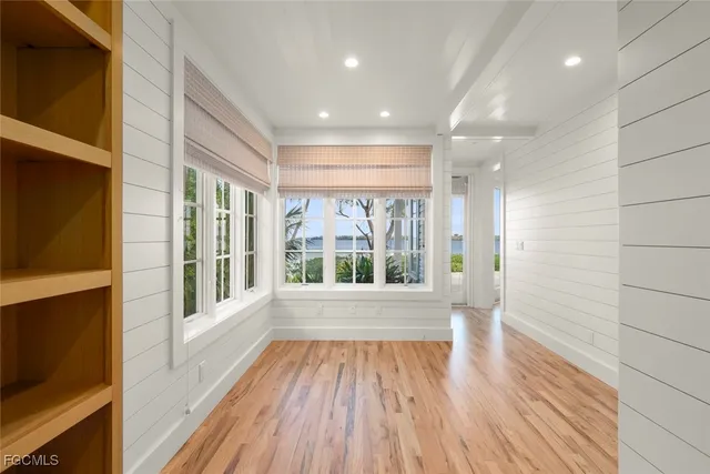 a utility room with cabinets washer and dryer