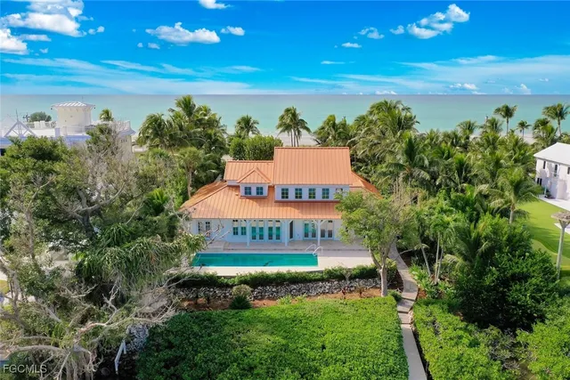 a view of a house with swimming pool garden and patio