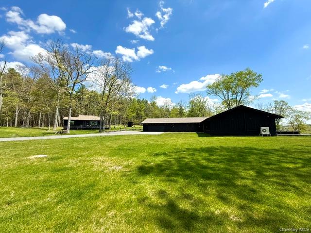 125 Mapes Road Barryville, NY 12719 - Photo 3 of 37 a view of a house with a backyard