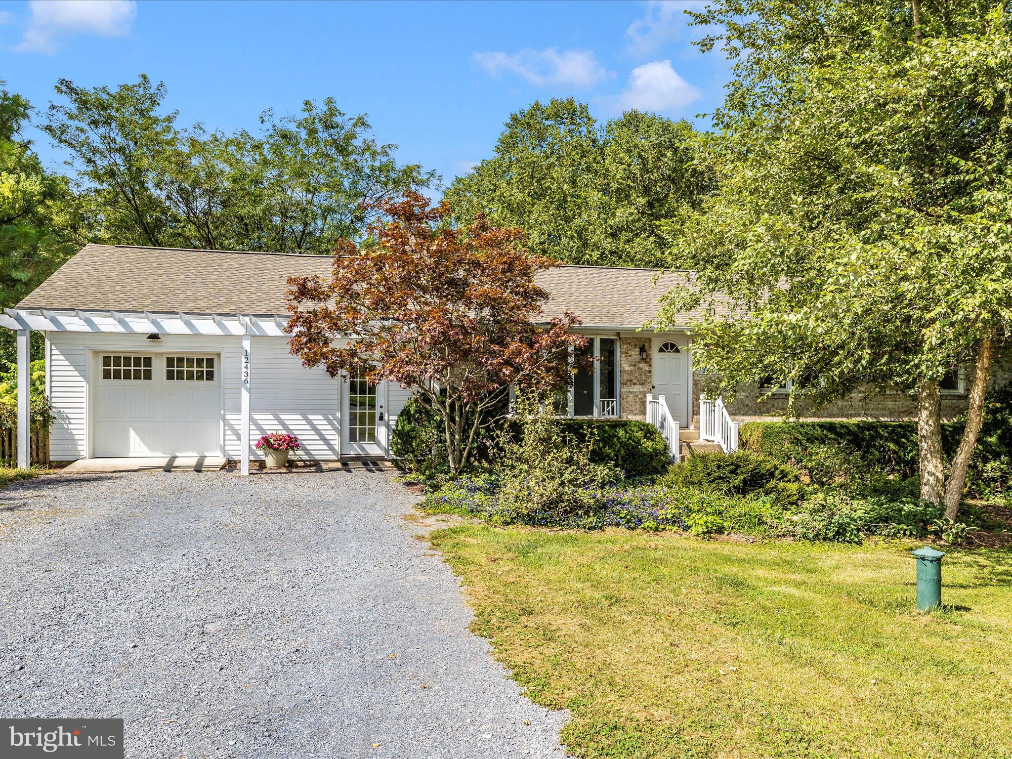 12436 Legore Road Keymar, MD 21757 - Photo 1 of 72 a view of a house with a yard and sitting area
