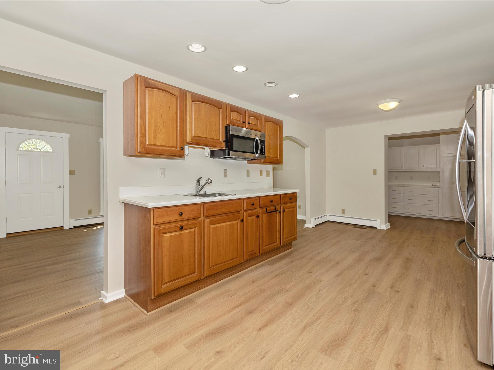 12436 Legore Road Keymar, MD 21757 - Photo 29 of 72 a kitchen with stainless steel appliances granite countertop a sink and cabinets