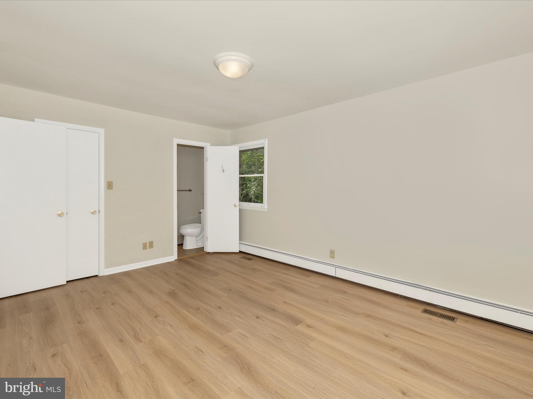 12436 Legore Road Keymar, MD 21757 - Photo 35 of 72 an empty room with wooden floor and windows