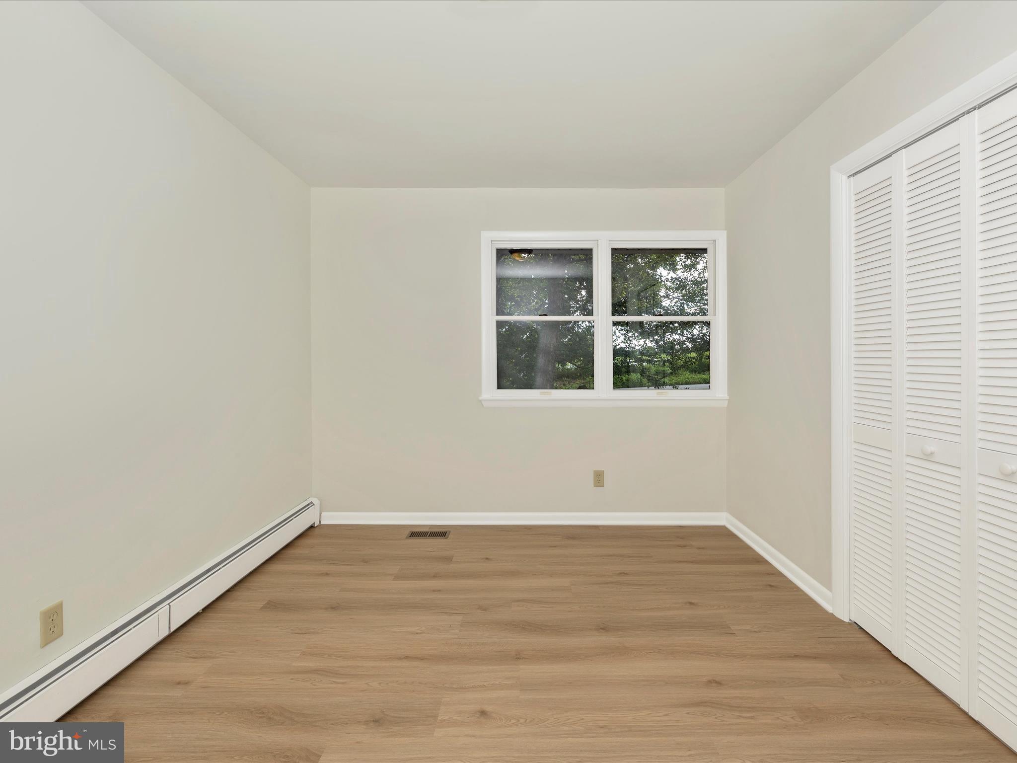 12436 Legore Road Keymar, MD 21757 - Photo 38 of 72 wooden floor in an empty room with a window